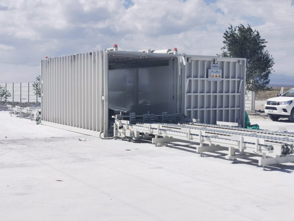 ALLCOLD 8-pallet vacuum cooler with automatic conveyor system installed outdoors for rapid produce cooling.