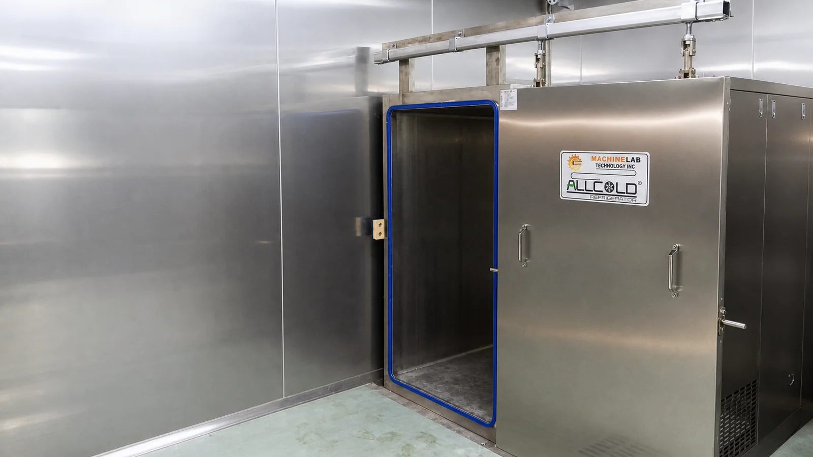 Real Allcold cooked-food vacuum cooler installed in a hygienic stainless-steel processing room with the chamber door open