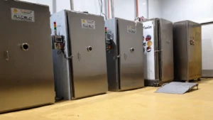 Row of real Allcold stainless-steel cooked-food vacuum coolers in the factory