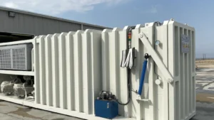 Allcold industrial vacuum cooler installed outdoors beside a produce processing building