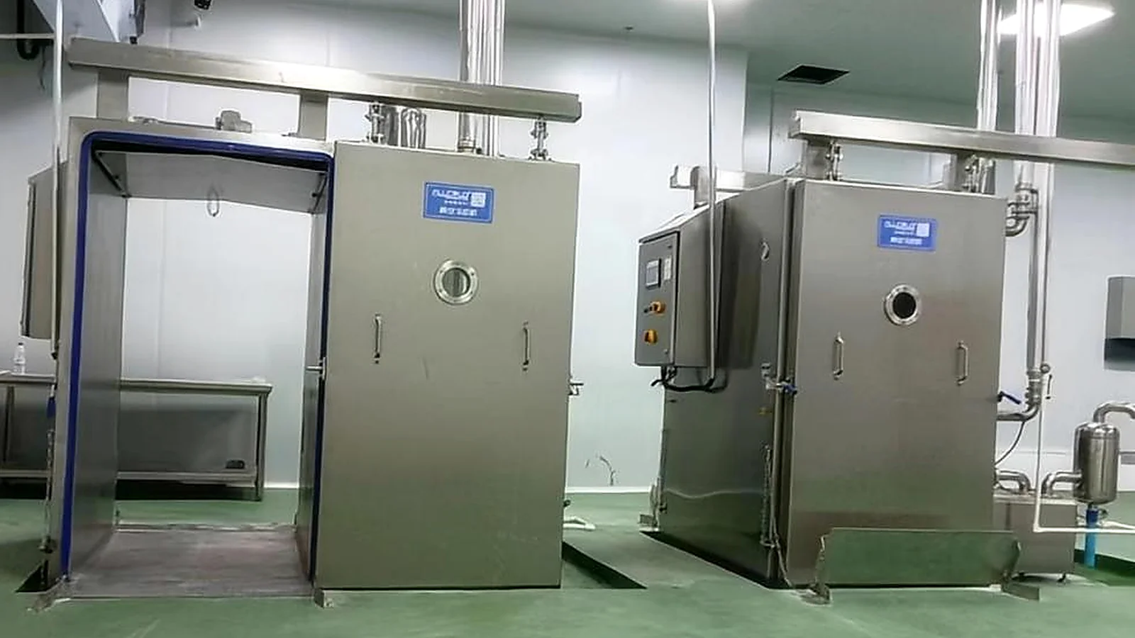 Two Allcold trolley vacuum cooling chambers installed in a hygienic food processing room