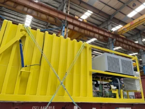 Yellow Allcold vacuum cooler on a transport platform, with chamber and refrigeration equipment visible