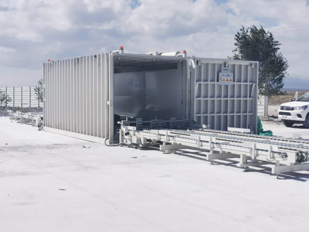 ALLCOLD 8-pallet vacuum cooler with automatic conveyor system installed outdoors for rapid produce cooling.