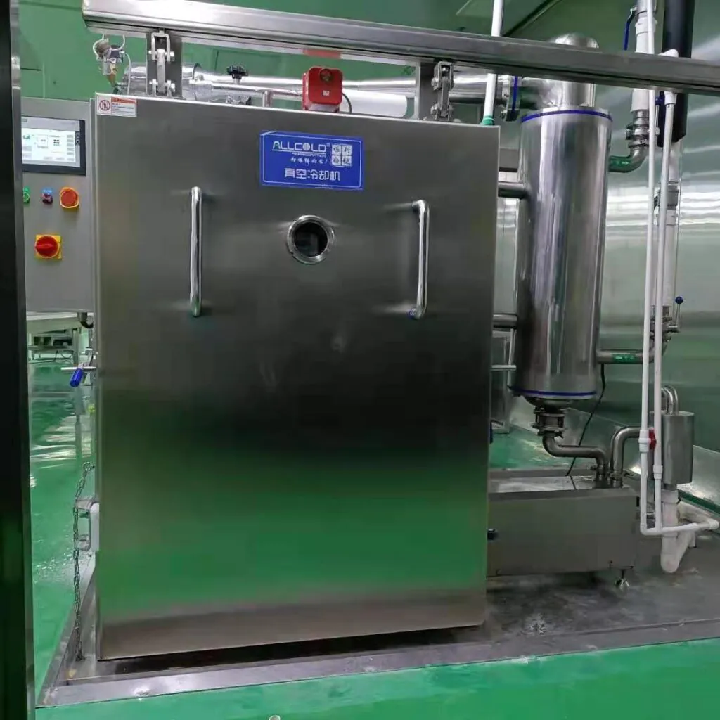 Stainless steel vacuum cooler integrated into a ready meal production line, designed for rapid cooling and food safety in industrial kitchens.