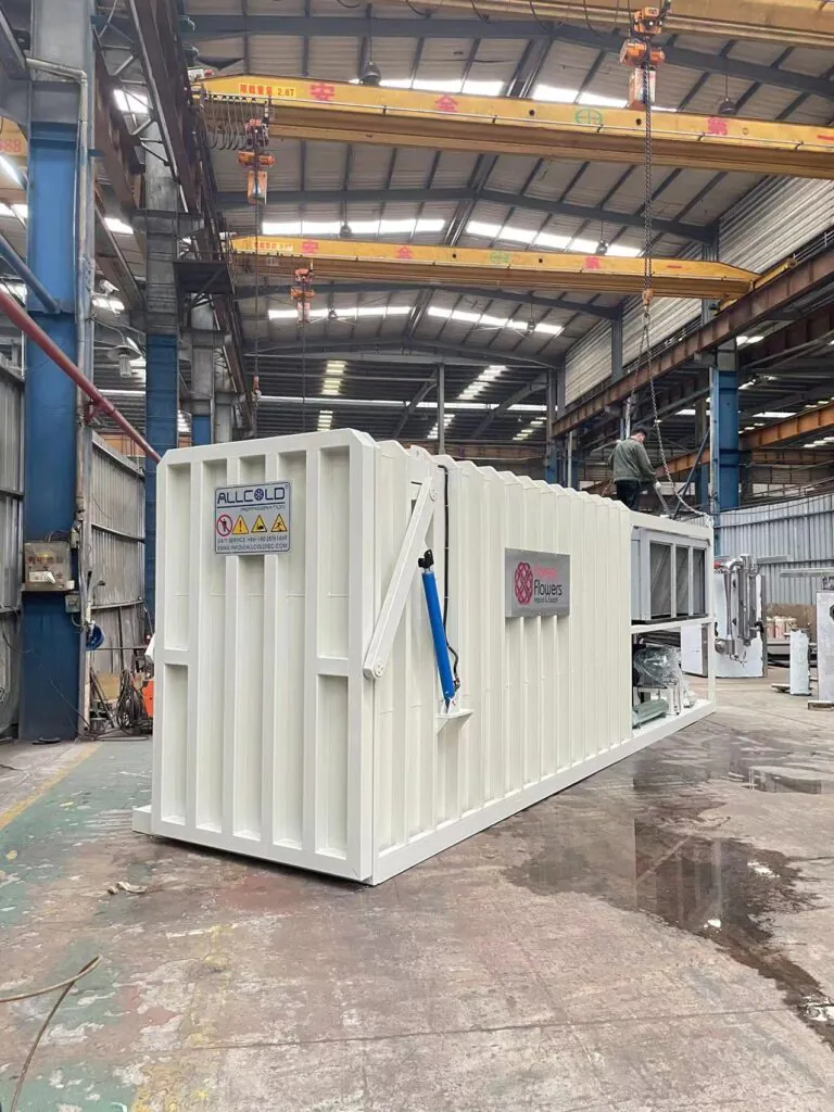 Factory-floor view of an Allcold vacuum cooler customized for fresh flower cooling, featuring a white container design and energy-efficient cooling units under assembly.