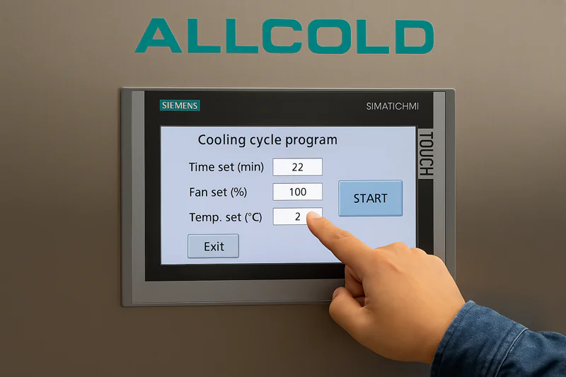 A close-up of a user's finger programming a cooling cycle on the Siemens touch screen of the ALLCOLD vacuum cooler.