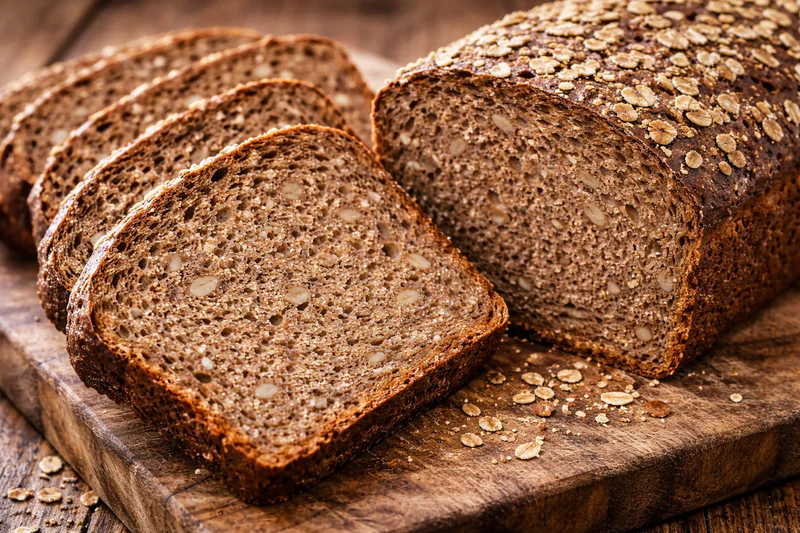 sliced heavy rye bread with dense texture