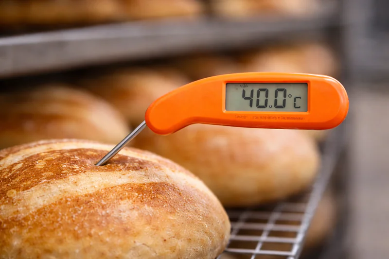 thermometer showing 40 degrees celsius on bread