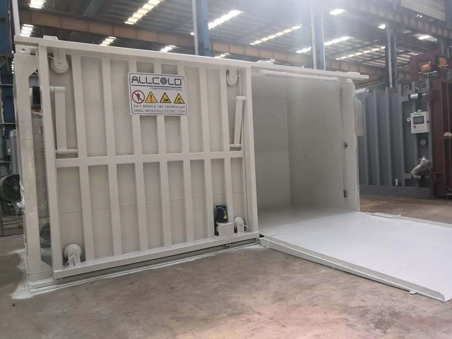 Real Allcold painted vacuum cooler with the chamber door moved horizontally along its floor and overhead rails